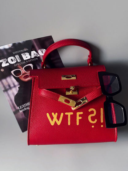 Červená kožená kabelka Zoi bag se zlatým nápisem "WTF"