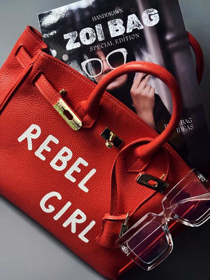 Oranžová art kožená kabelka Zoi Bag s nápisem "Rebel Girl"